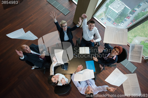 Image of happy business people group on meeting at modern office