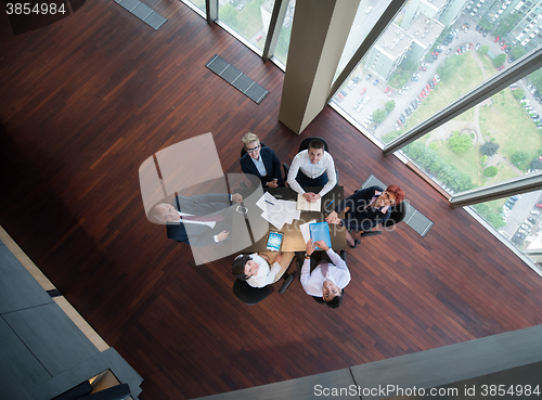 Image of happy business people group on meeting at modern office