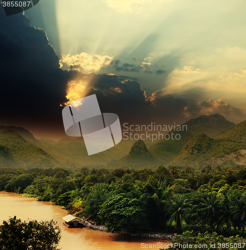 Image of Sunset with rays over river