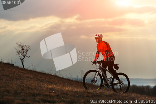 Image of Man cyclist riding the bicycle