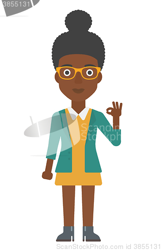 Image of Woman gesturing OK sign. 