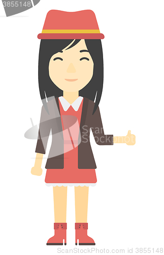 Image of Woman showing thumbs up.