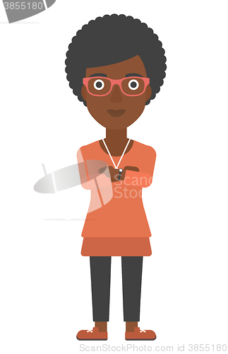 Image of Woman standing with crossed arms.