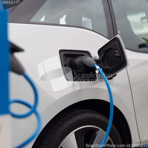 Image of Electric Car in Charging Station.