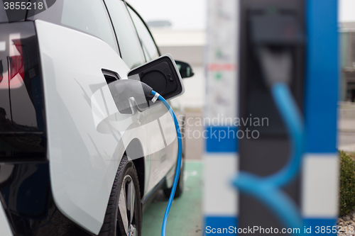 Image of Electric Car in Charging Station.