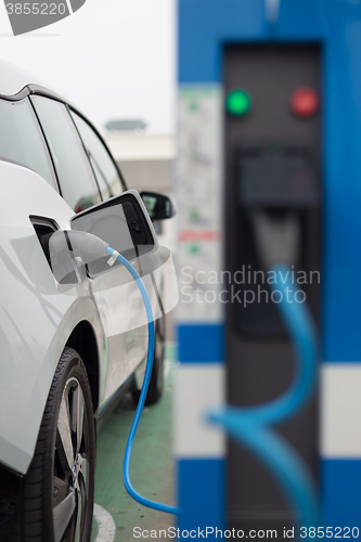 Image of Electric Car in Charging Station.