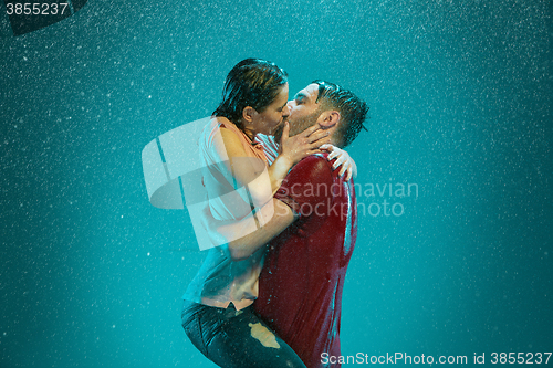 Image of The loving couple in the rain