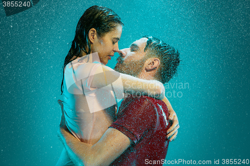 Image of The loving couple in the rain