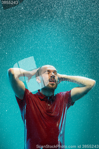 Image of The portrait of young man in the rain