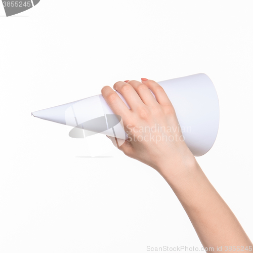 Image of The cone in female hands on white background