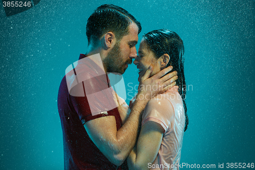 Image of The loving couple in the rain