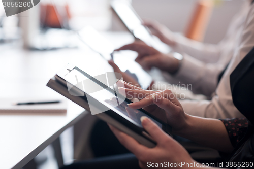 Image of business people on meeting  using tablet