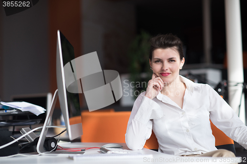 Image of happy young business woman relaxing and geting insiration