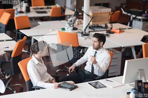 Image of business couple working together on project