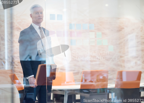 Image of portrait of handsome senior business man at modern office