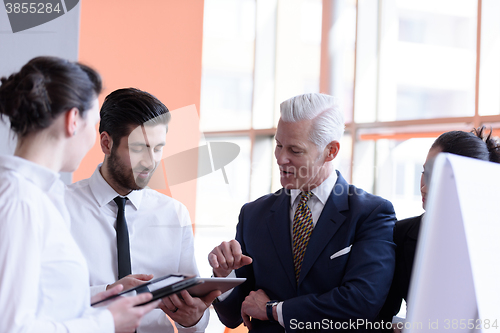 Image of young startup businessman making presentation to senior investio