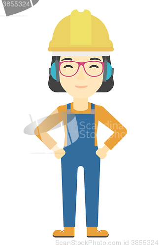 Image of Woman wearing hard hat and headphones 