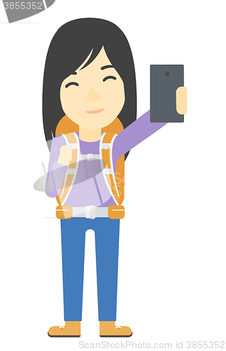 Image of Backpckaer making selfie.