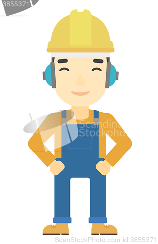 Image of Man wearing hard hat and headphones 