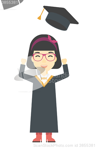 Image of Graduate throwing up her hat.