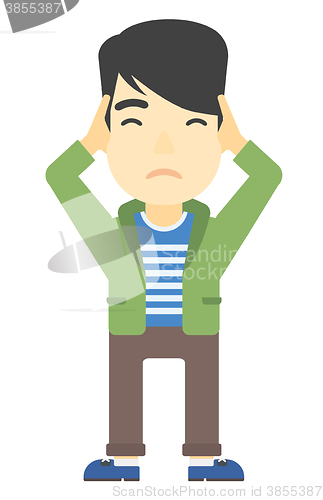 Image of Man clutching his head in desperate.