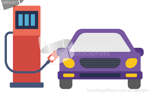 Image of Car at gas station being filled with fuel.