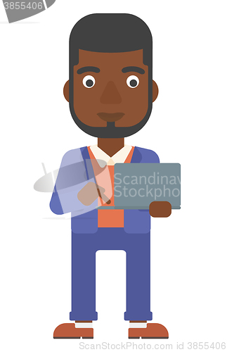 Image of Man using laptop.