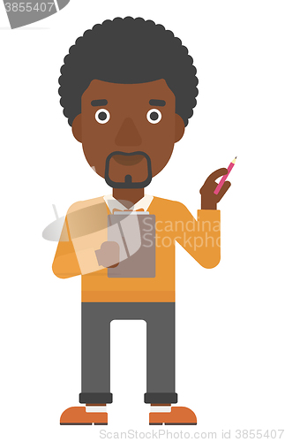 Image of Man standing with pen and file in hands.