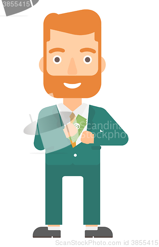 Image of Man putting money in pocket.