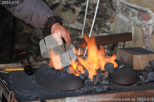 Image of old smithery and fire