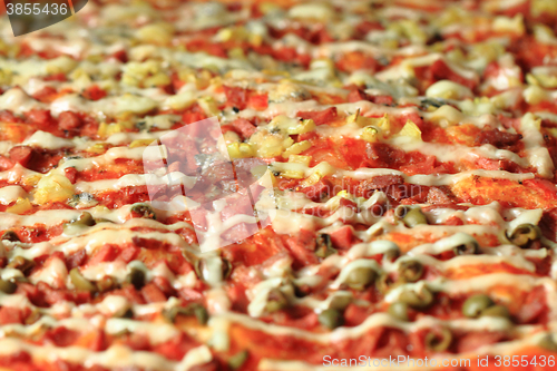 Image of home made pizza with cheese onion and tomato