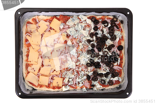 Image of raw home made pizza before baking