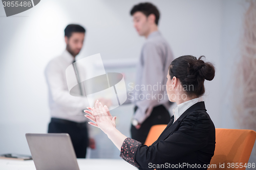 Image of young business woman on meeting  using laptop computer