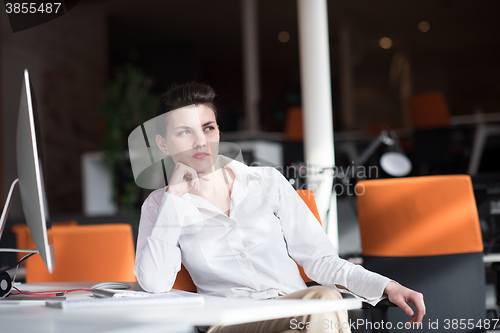 Image of happy young business woman relaxing and geting insiration