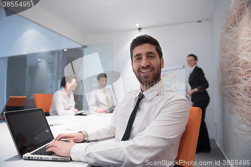 Image of young business man at meeting