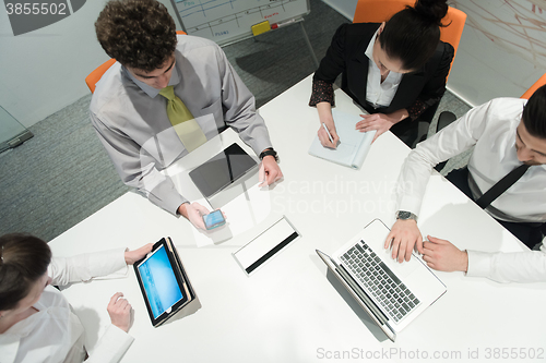 Image of aerial view of business people group brainstorming on meeting