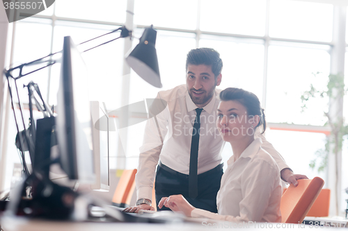 Image of business couple working together on project