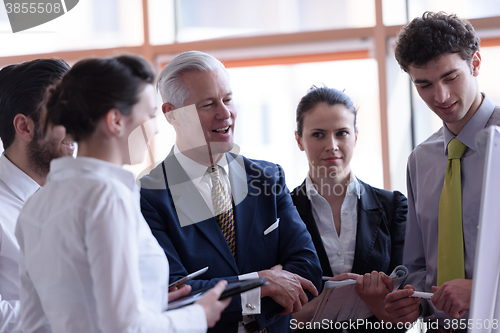 Image of young startup businessman making presentation to senior investio