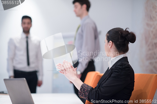 Image of young business woman on meeting  using laptop computer