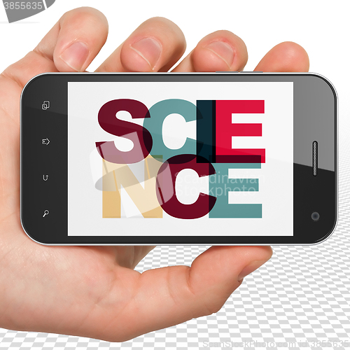 Image of Science concept: Hand Holding Smartphone with Science on  display