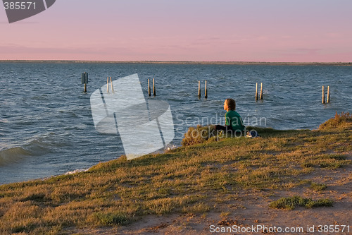 Image of boy looking over lake