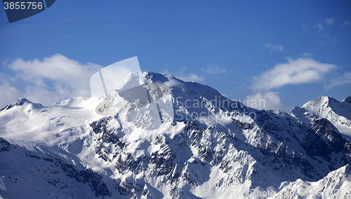 Image of Snowy mountains at sun day