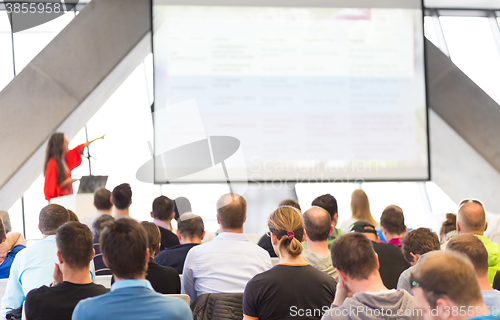 Image of Female speeker having talk at public event.