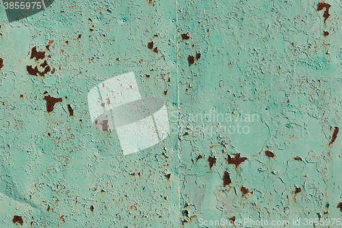 Image of Old green cracked paint on metal background