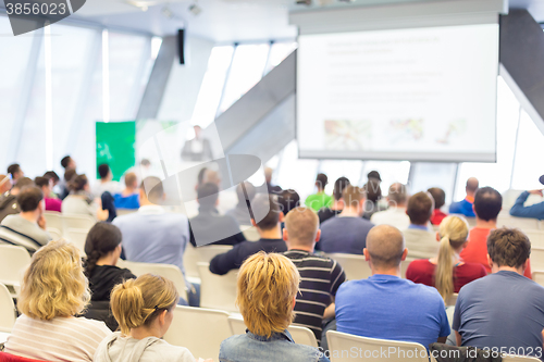 Image of Male speeker having talk at public event.