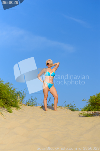 Image of Woman in a blue bikini