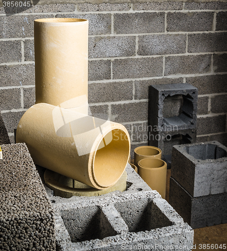 Image of Construction of modular ceramic chimney in the house