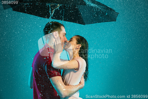 Image of The loving couple in the rain