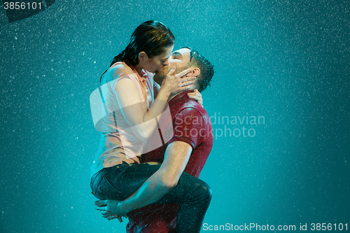 Image of The loving couple in the rain