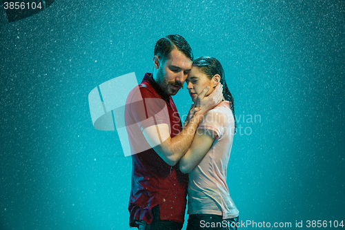 Image of The loving couple in the rain